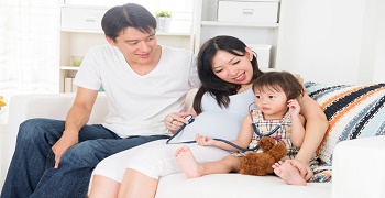 asian pregnant couple enjoying quality time with family